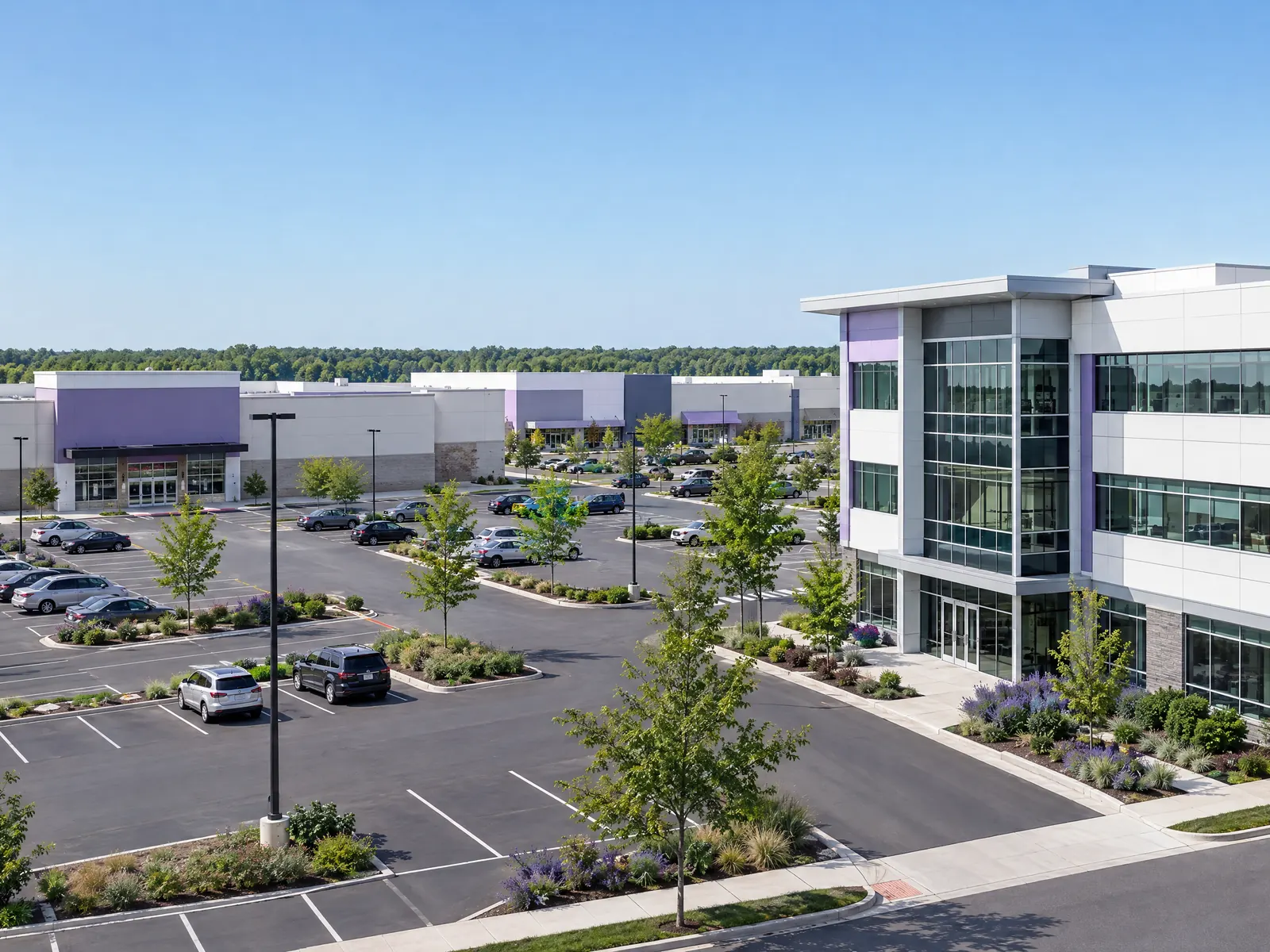 Large parking lot beside big box stores and a modern three story medical office building